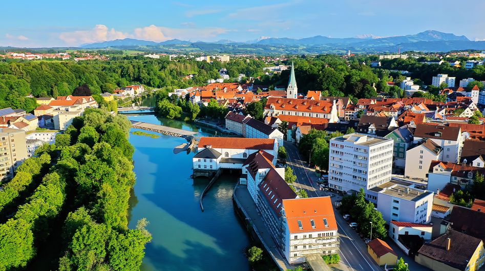 View of Kempten city centre with the Iller River and the Alps in the background